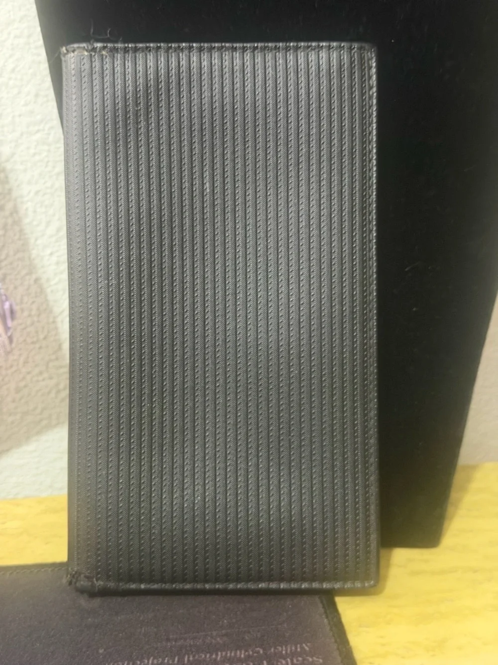 BVLGARI Mille Righe long wallet made from PVC and leather.